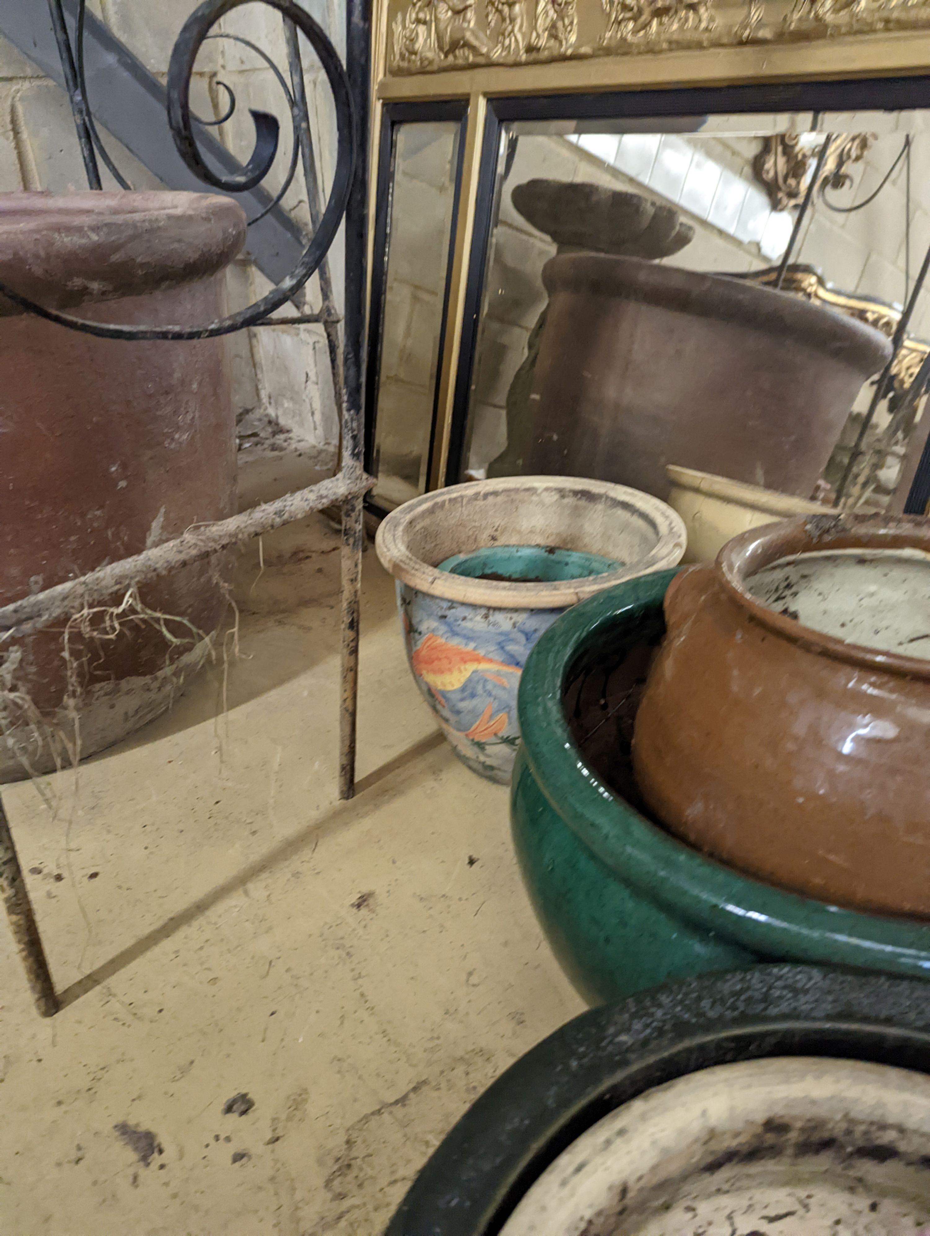 Nine earthenware garden planters, largest diameter 42cm